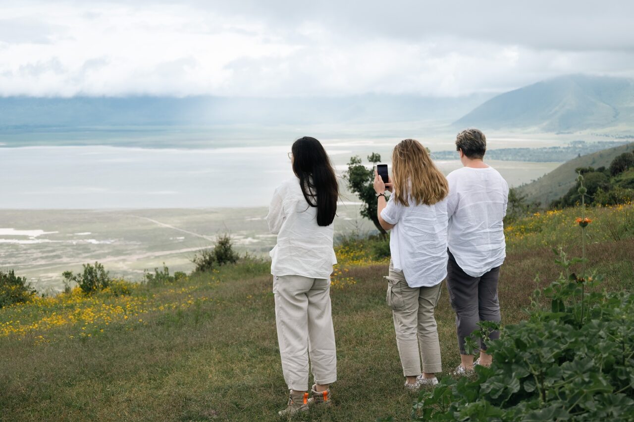 Three guests looking out over the Ngorongoro Crater rim