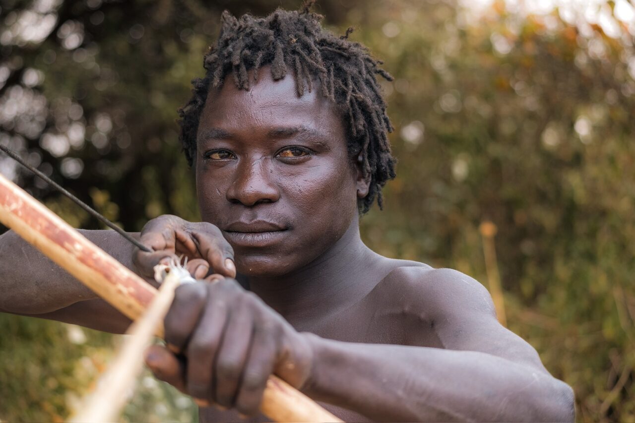 Portrait of a Hadzabe archer with his handmade bow